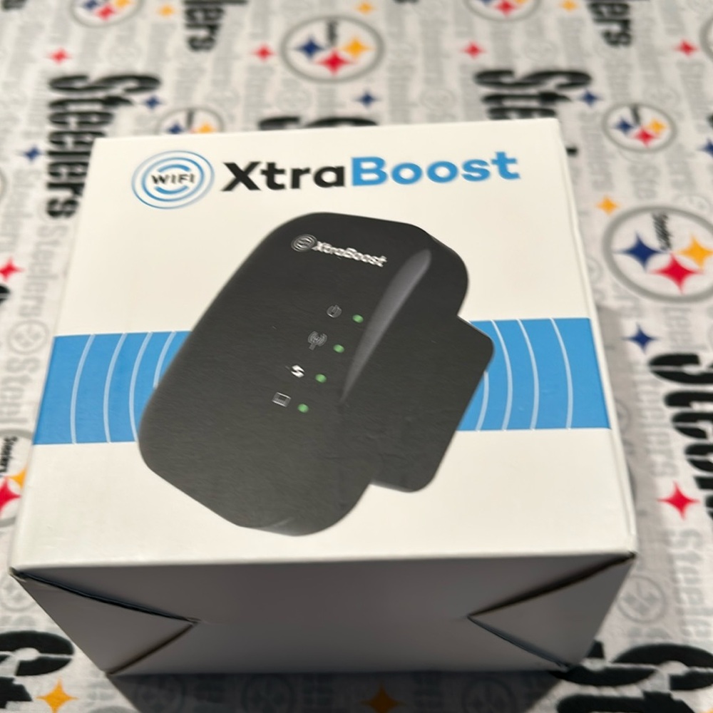 New in box WiFi extra boost. Never used Smoke free pet free home